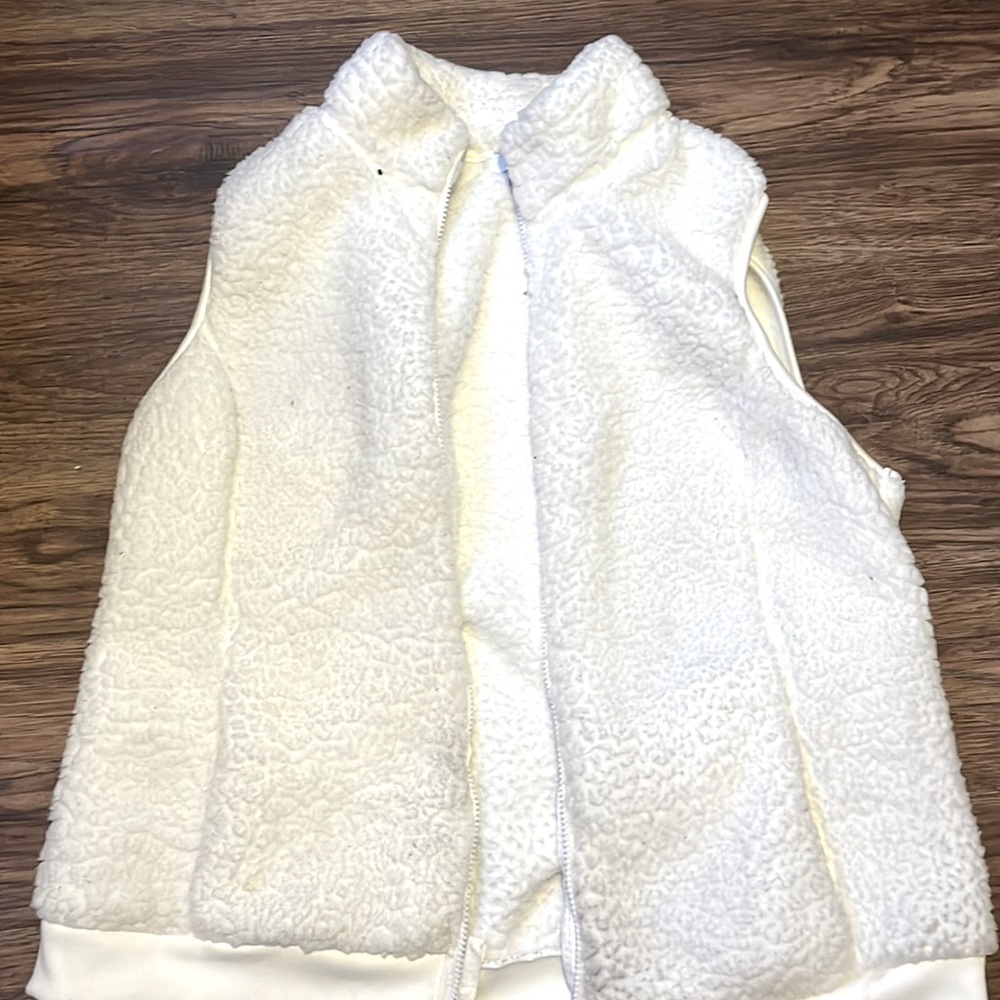 A white fluffy vest